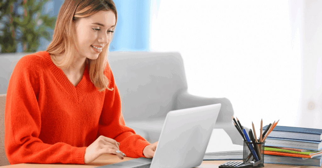Changing your career following redundancy, studying online with Lewis College on laptop.